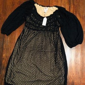 Black dress with tan colored lining